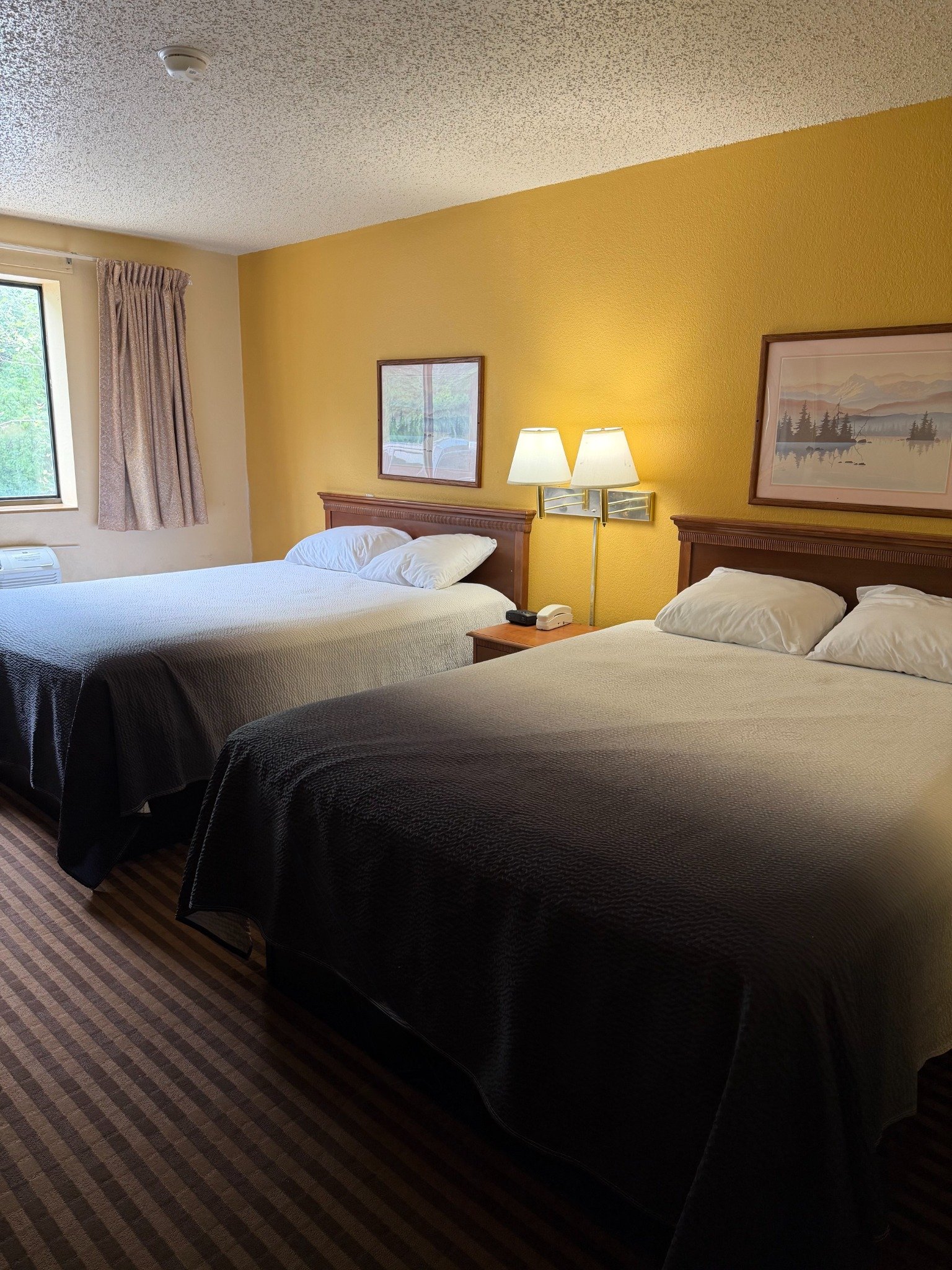 Room with two double beds at La Vale Inn