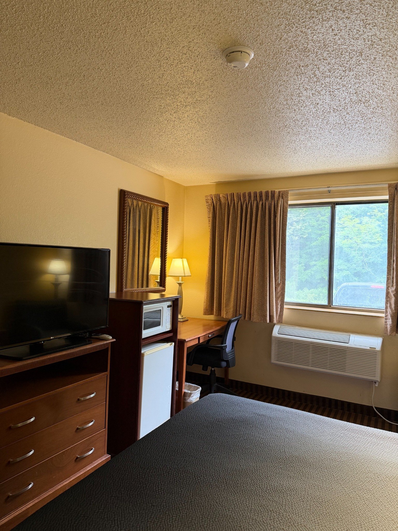 Guest room television refrigerator and desk